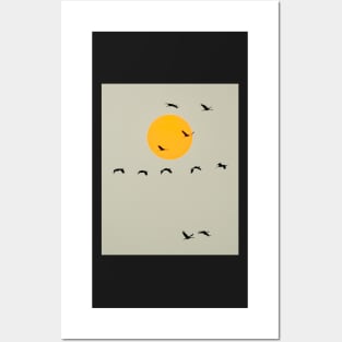 Common Cranes Flying in Front of Orange Setting Sun Posters and Art